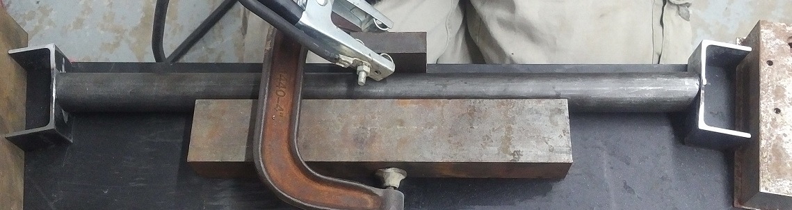 Bare Axle with knuckles being welded